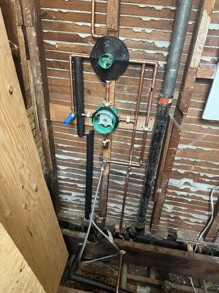 Licensed plumber's copper backflow prevention and pressure regulator installation